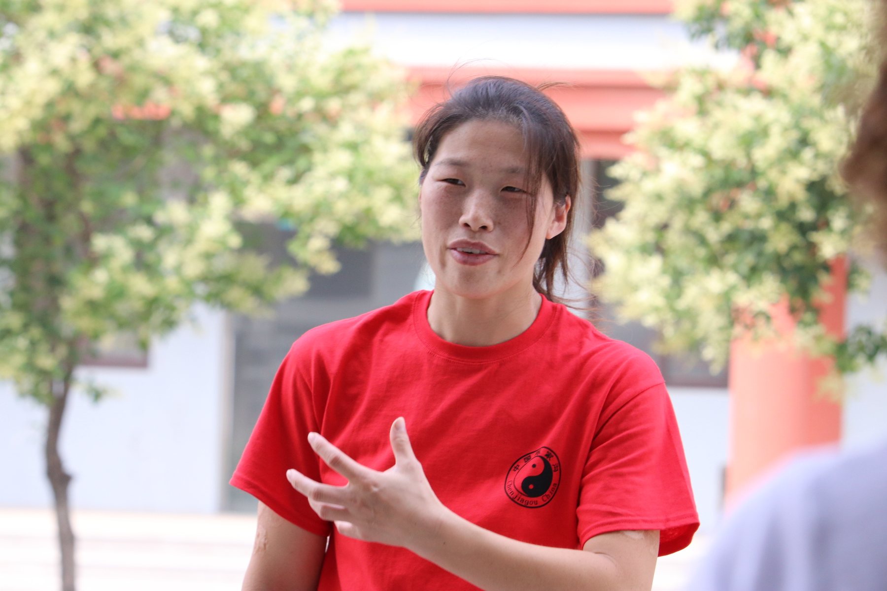 Portrait of Master Chen Huixian teaching outdoors in Chenjiagou