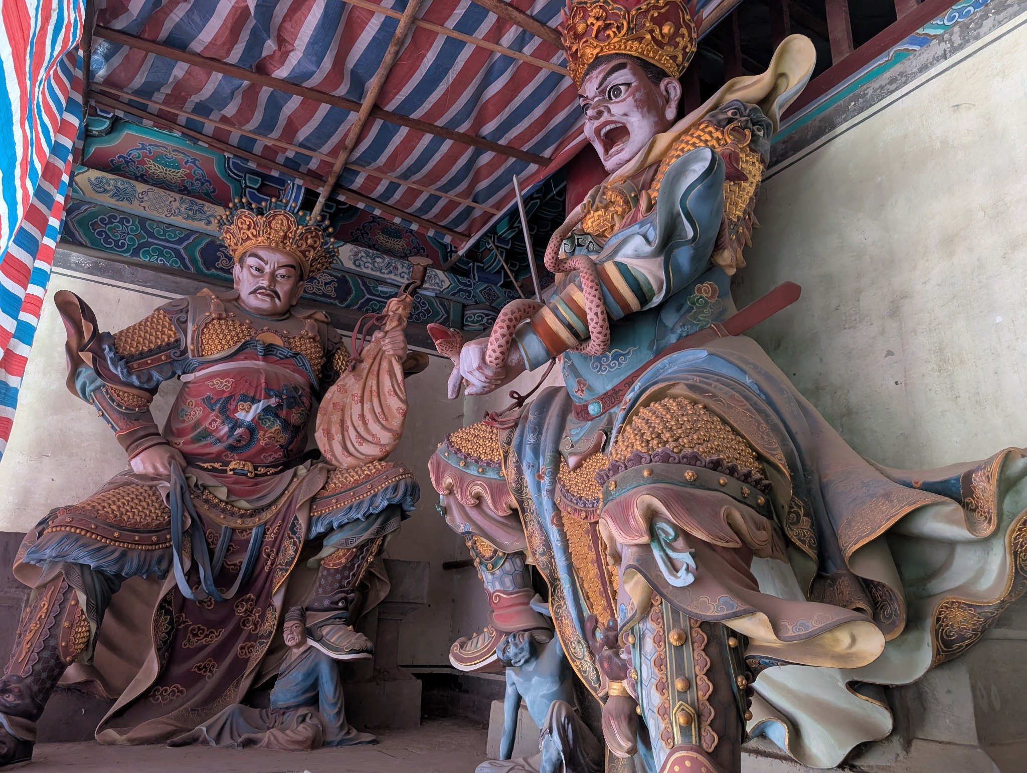 Colorful guardian figures at Shaolin Temple