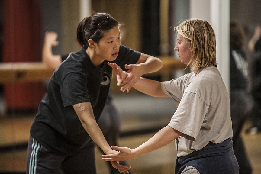 Master Chen Huixian guiding a student through partner structure and hand position