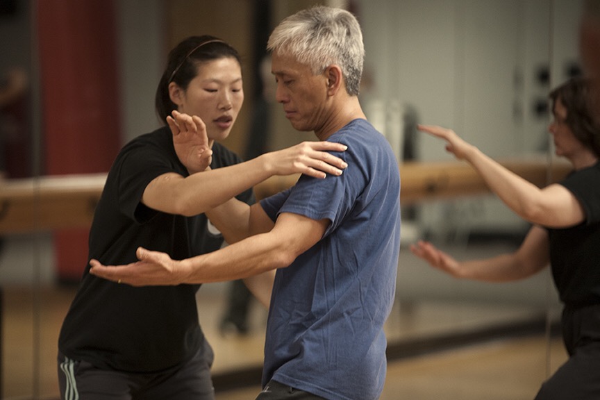 Master Chen Huixian correcting a student during Chen Taijiquan partner practice