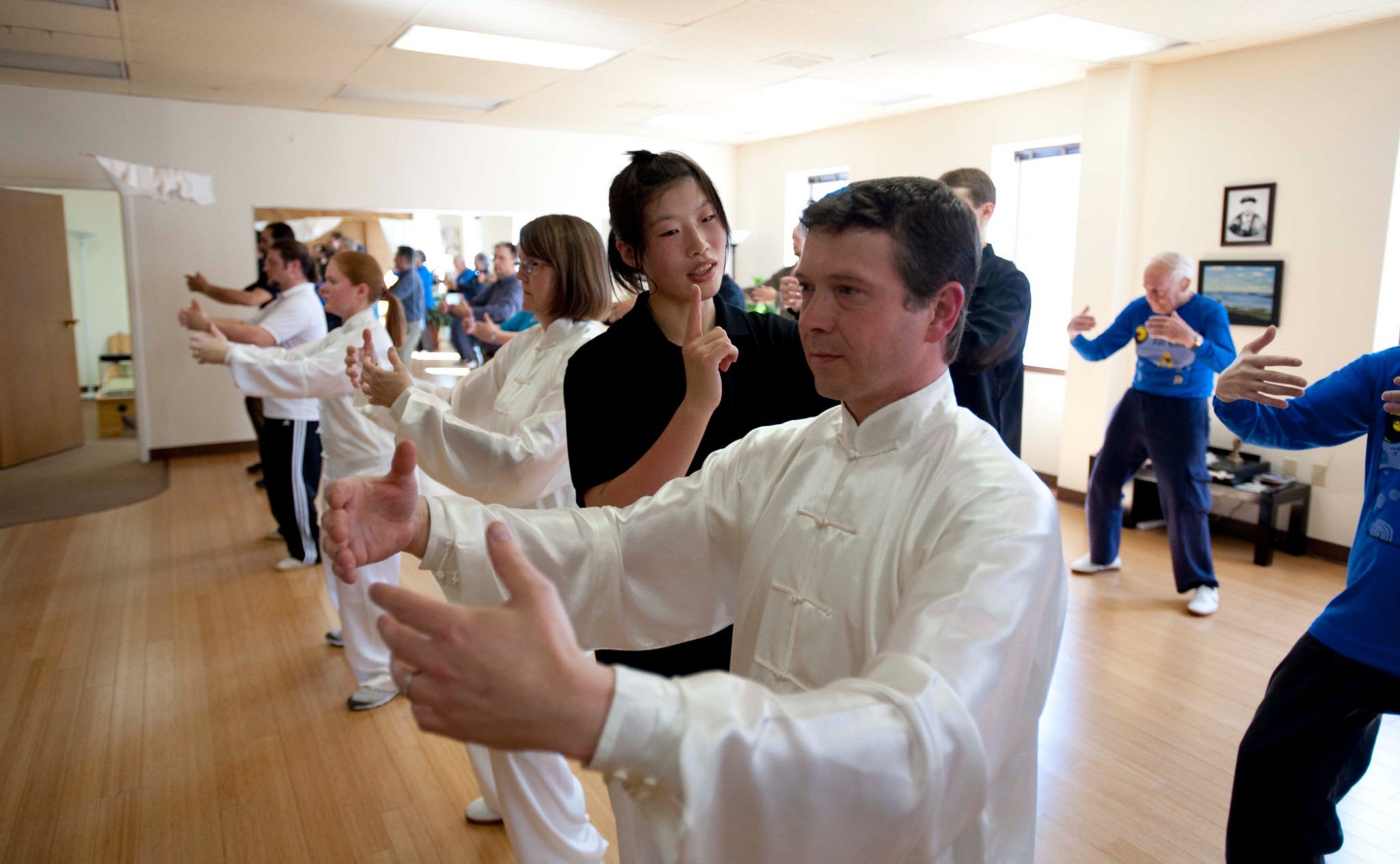 Master Chen Huixian leading students through Chen Taijiquan in a studio